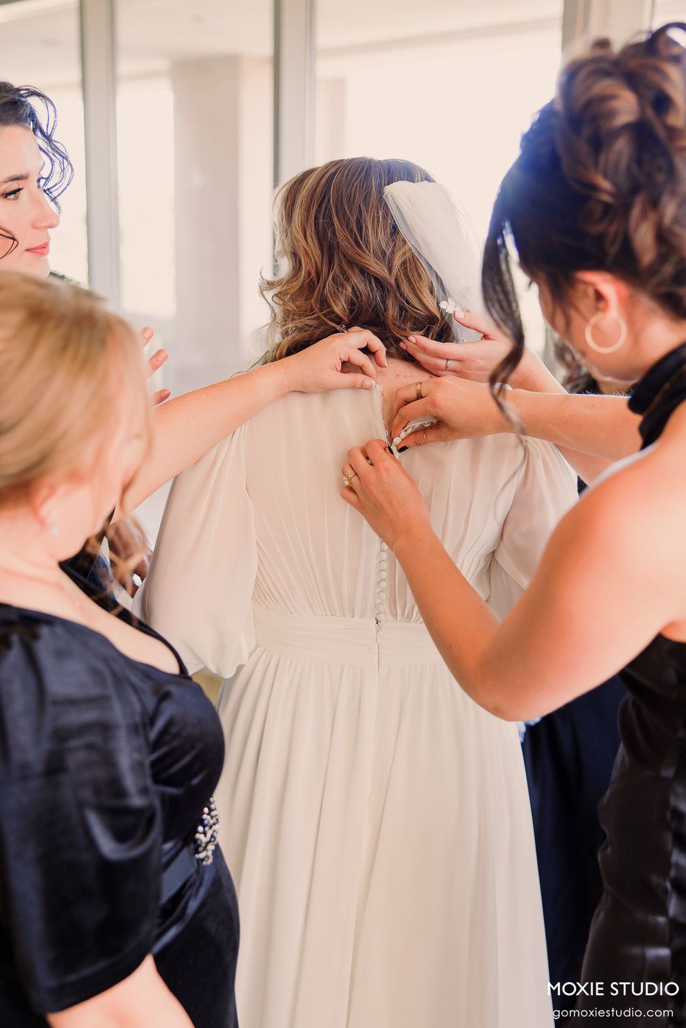 Sequence of joyful getting ready moments in a bright room with white curtains and natural light.