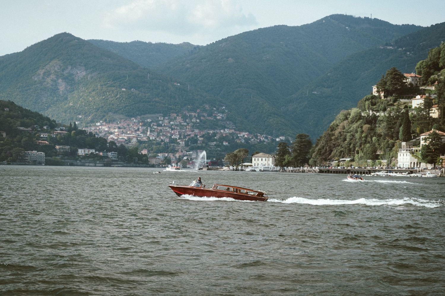 A classic wooden speed boat on lake como