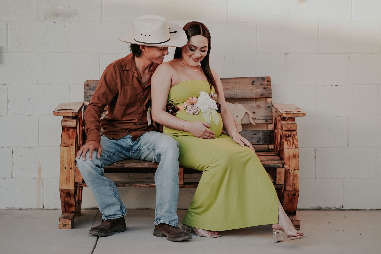 Casual portrait session on rustic wooden bench with vintage styling.