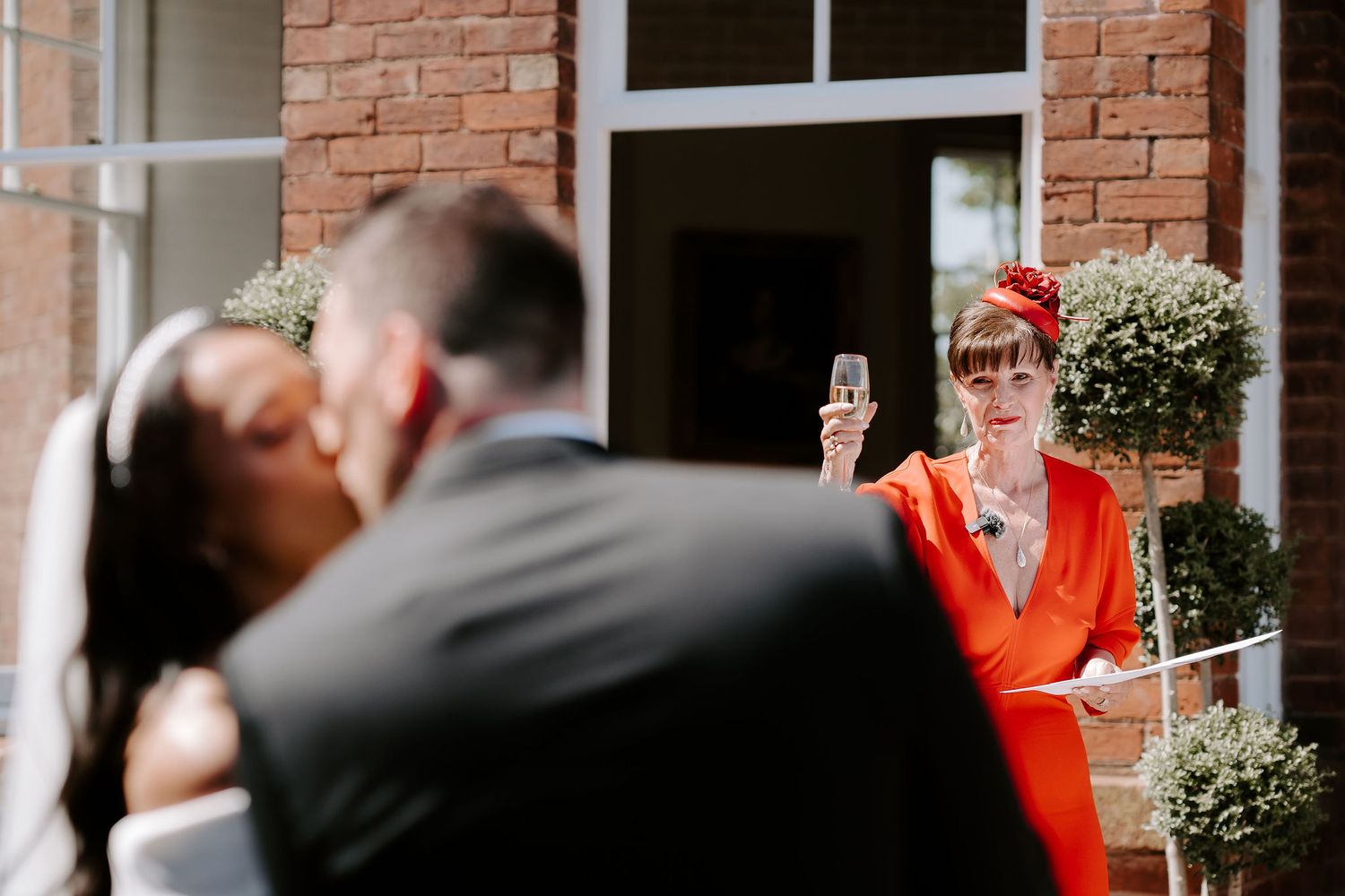 bride-and-groom-kissing-speeches-stockton-house-wedding-shropshire