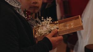 A close-up of wedding ceremony details with decorative elements and warm lighting.