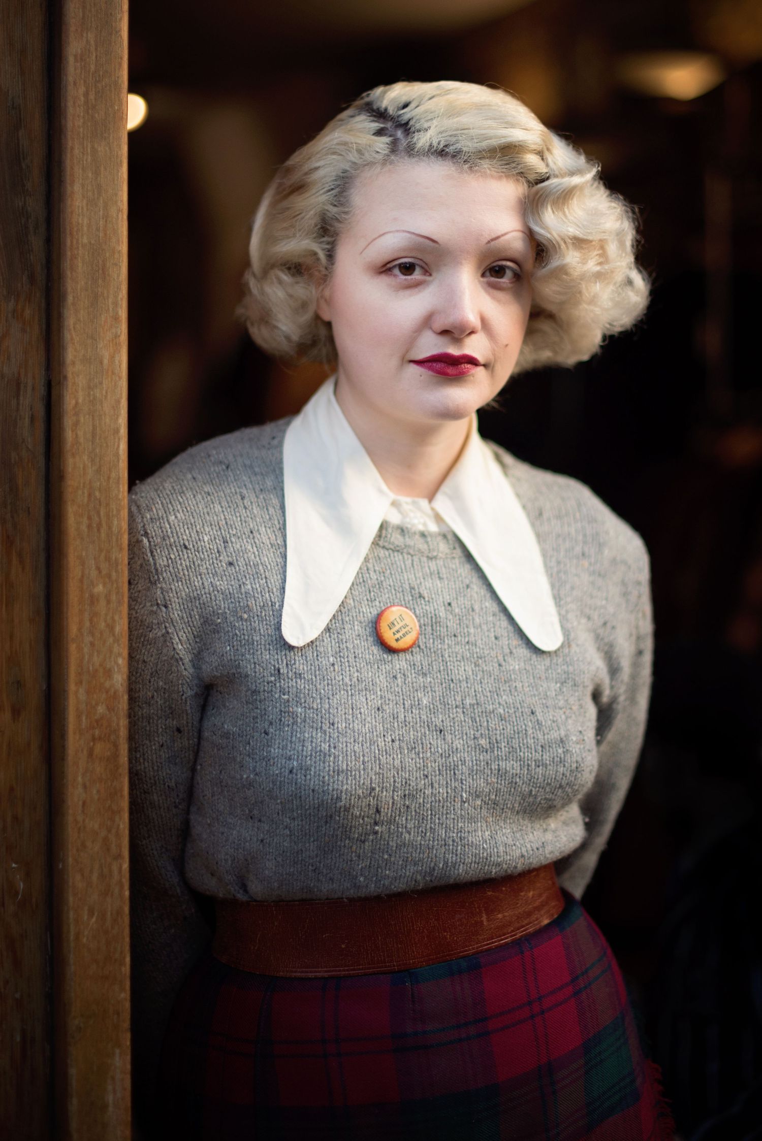 Beautiful portrait of a woman in vintage clothing, hair and makeup at Shoreditch's Hunky Dory shop
