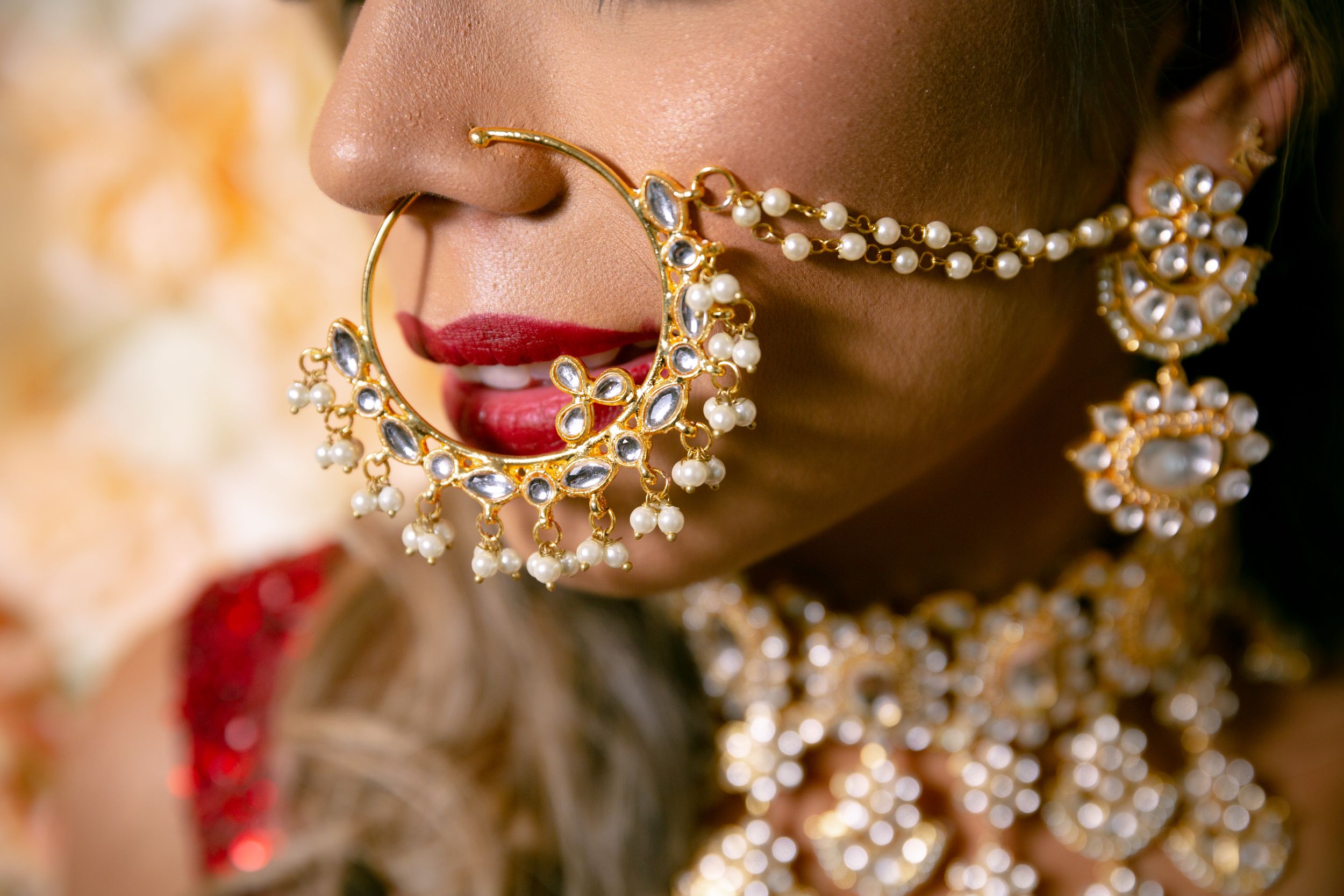 Close-up detail shots of gold bridal jewelry and accessories with pearl embellishments.