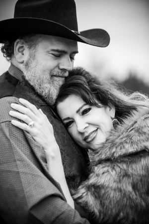 man and woman holding each other close family portrait anniversary couples