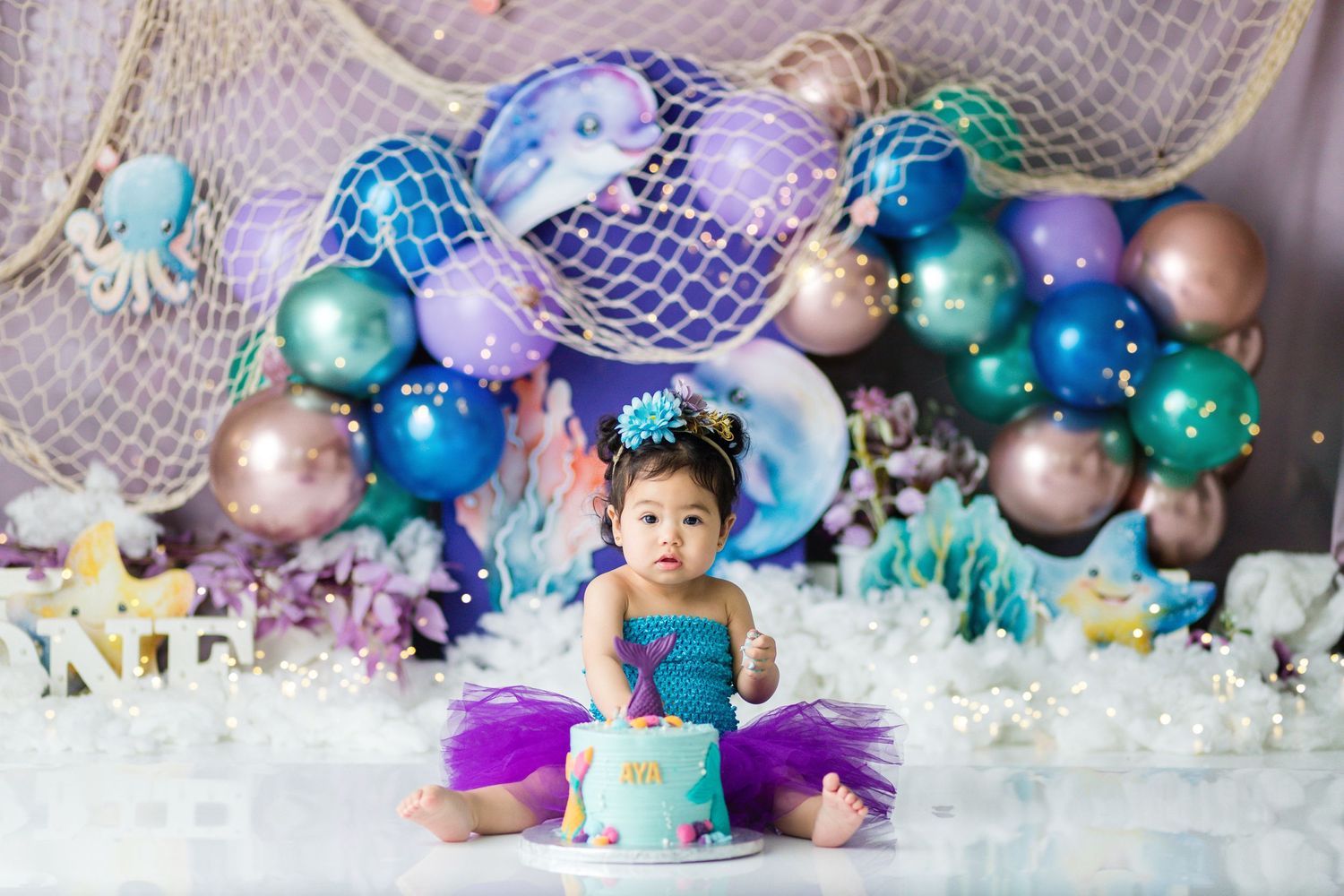 cake smash photoshoot in qatar with theme and prop.