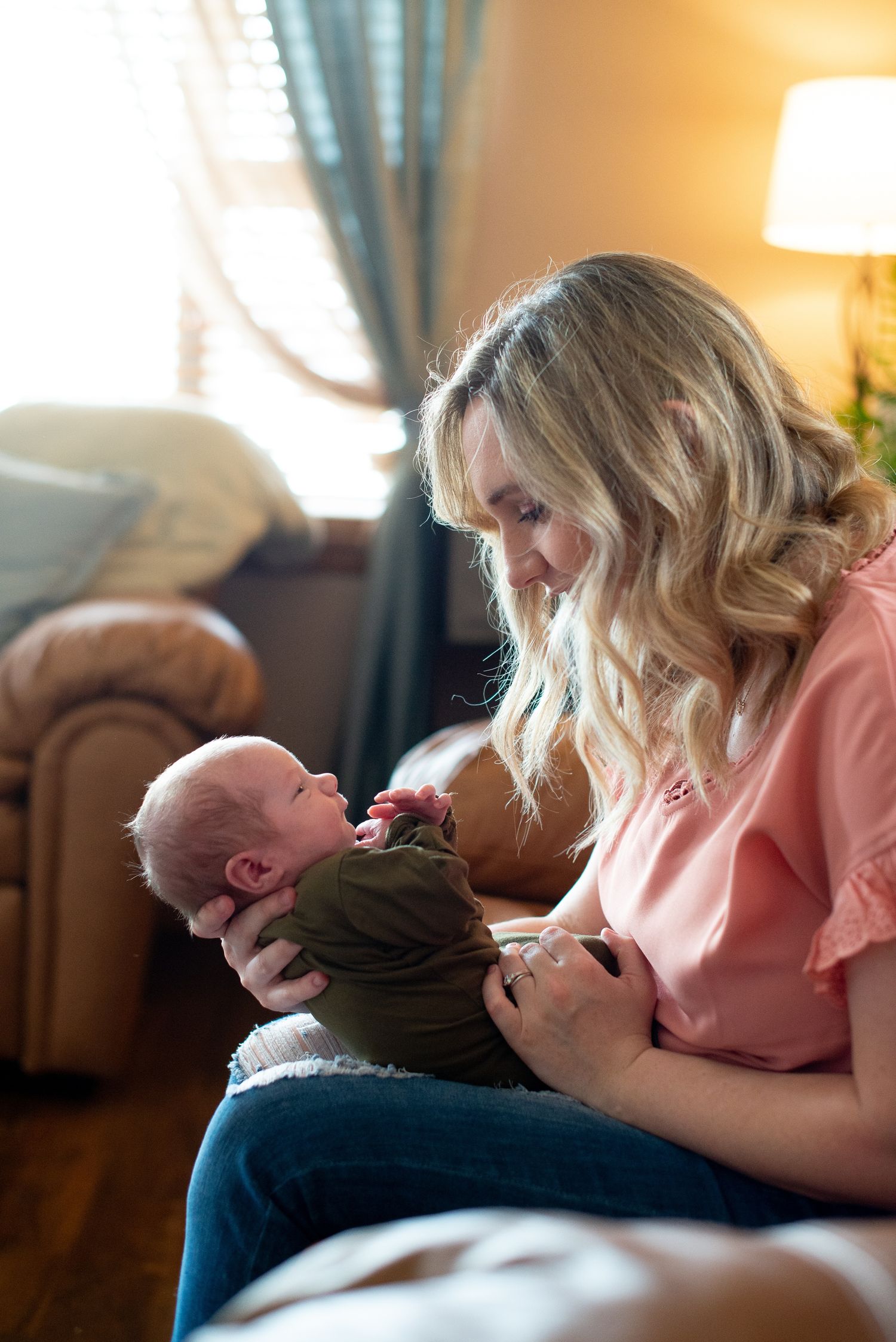 In-home lifestyle newborn family photo session by Wichita photographer