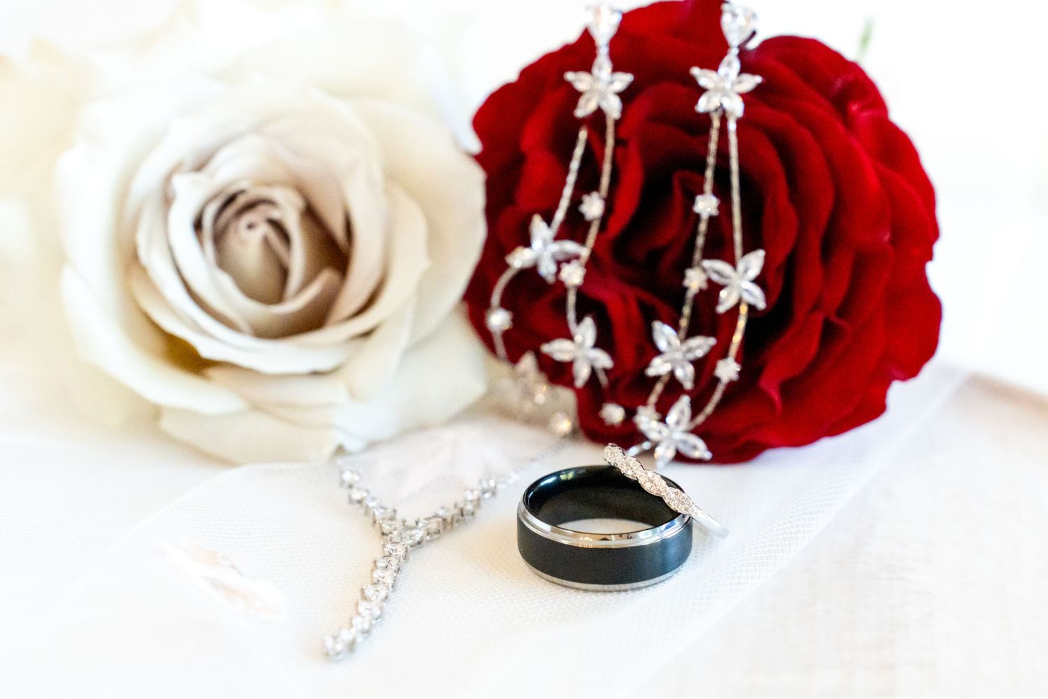 wedding rings with jewelry and roses