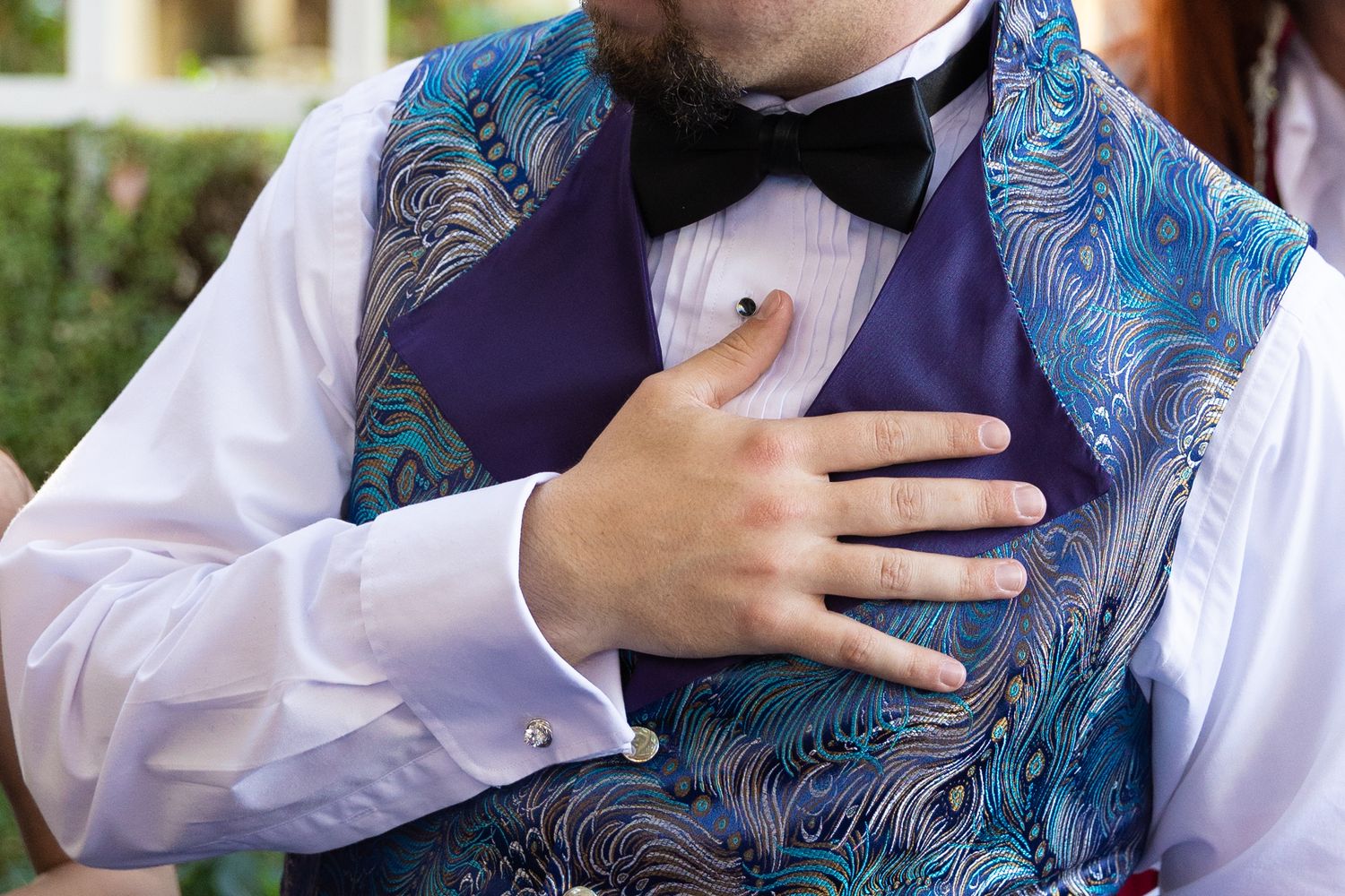 Groom holding his hand to his heart during Ketubah speech.