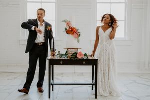 Wedding venue setup with white walls and minimalist decor.