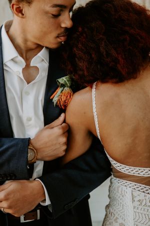 Intimate wedding portrait showing tender moments between newlyweds.