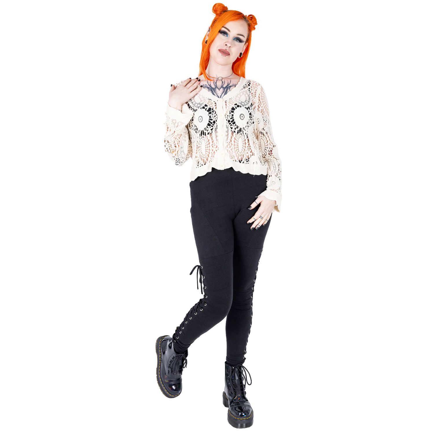 Alternative emo styled tattooed femme model with orange hair for small fashion brand in a photography studio in Hove