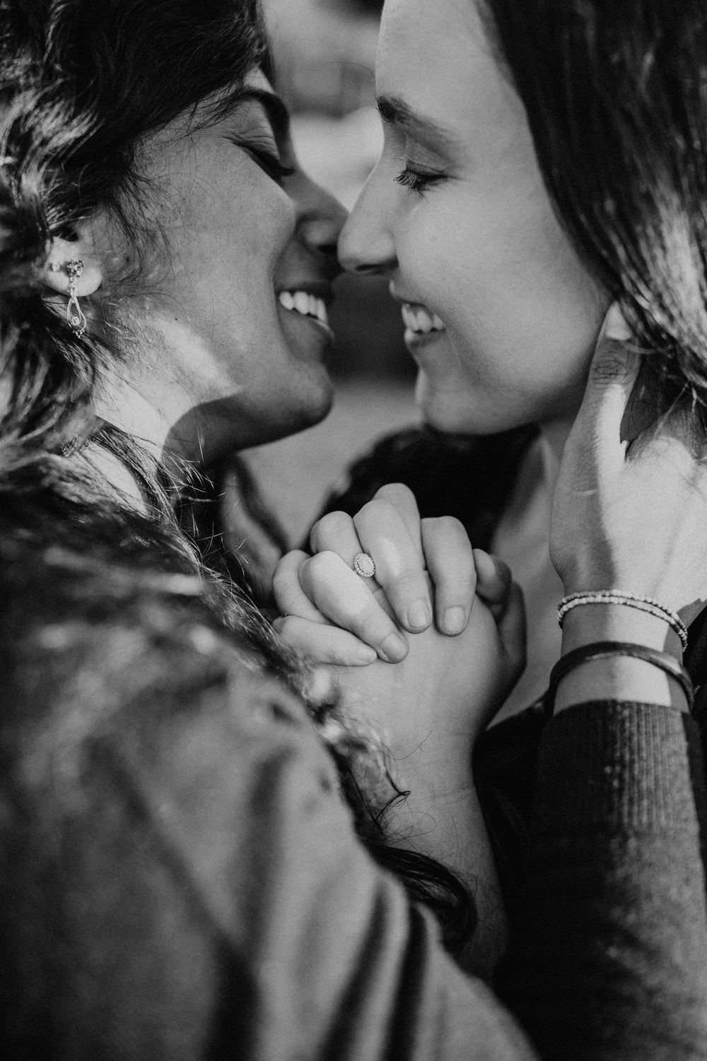Black and white intimate portrait of couple sharing tender moment.