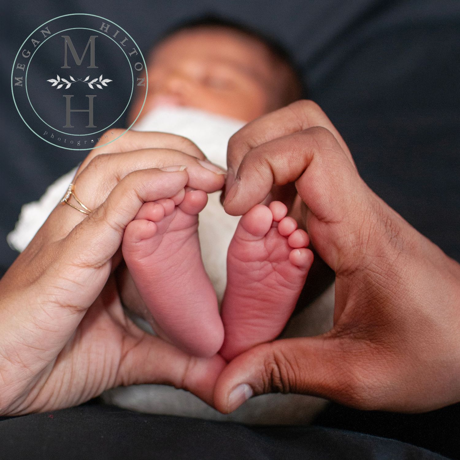 heart with parent hands and baby feet picture