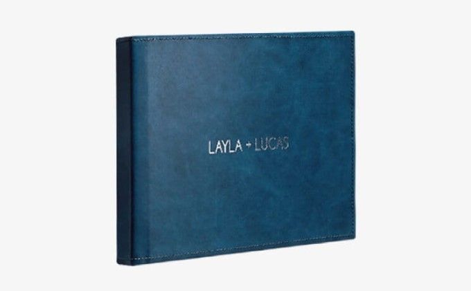 Customized stiched genuine leather cover with embossed initials, adding a personal touch to the photo album