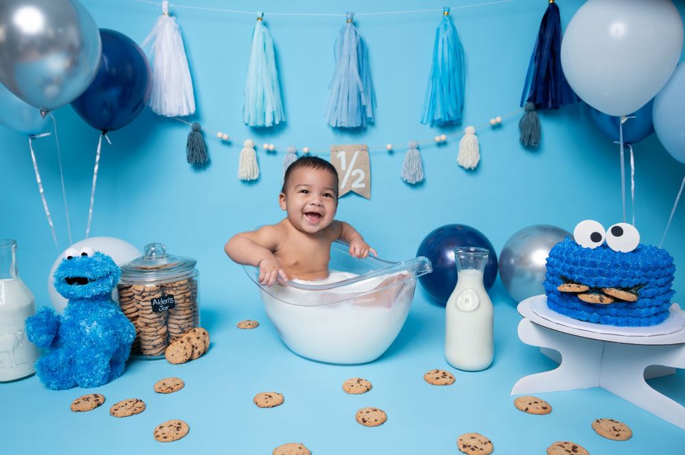 Cookie Monster themed half birthday photoshoot with baby in milk bath.