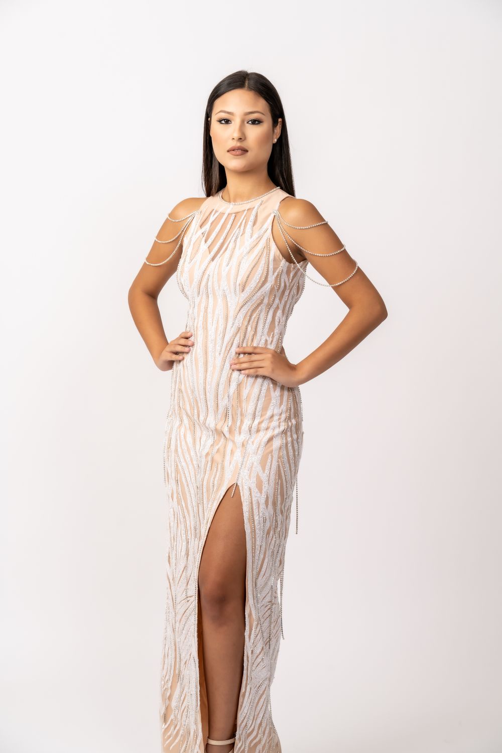 Elegant maxi dress with beige zebra pattern and thigh slit on light background.