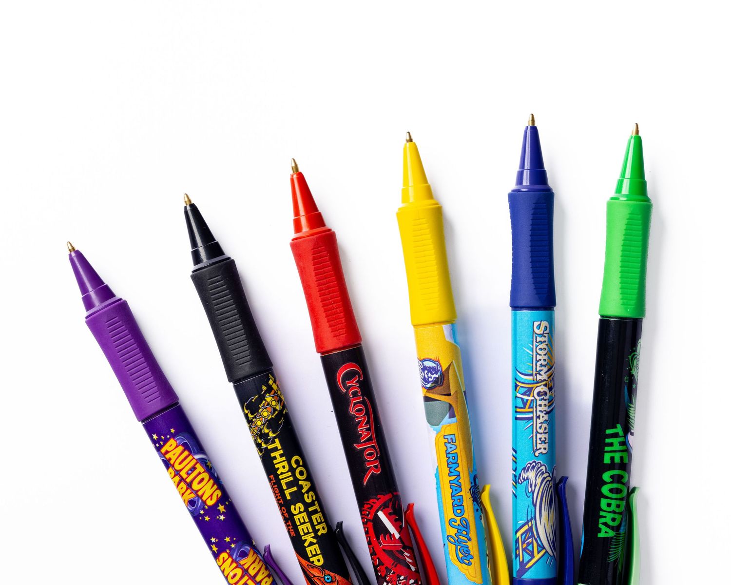 Colourful marker pens fanned out on a white background for Paultons Park, stationery merchandise product photography