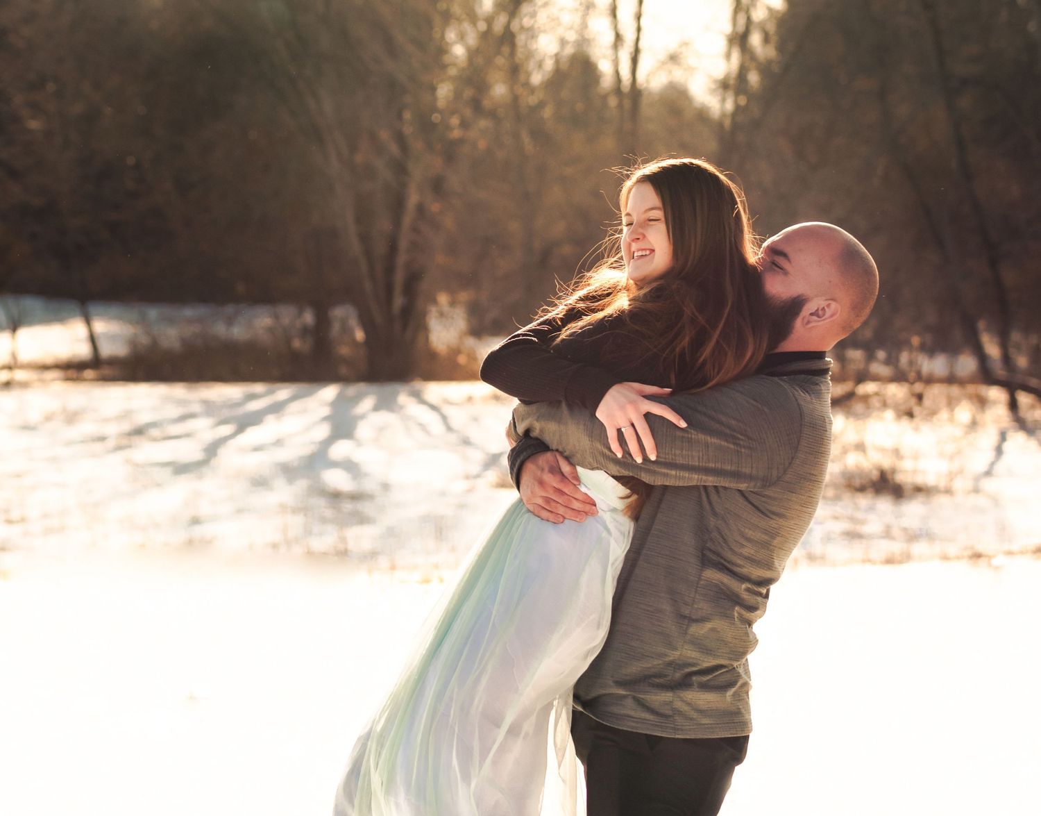 couple hugging in snow at walnut woods metro park