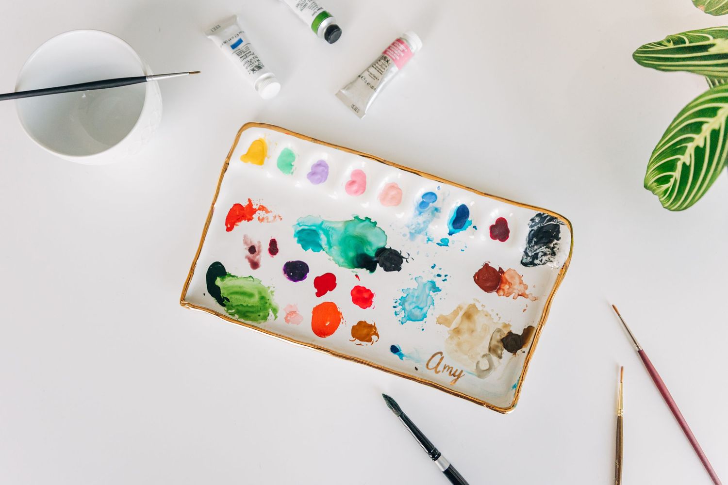 Charlotte branding photography for local artist branding photo with paints and brushes