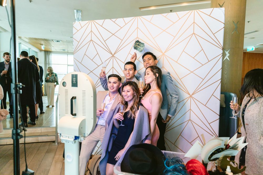 Wedding Guests using photobooth during the reception at HIlton Hotel AUckland
