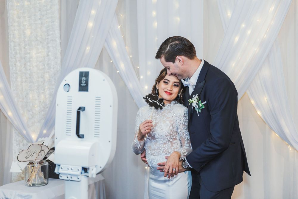 Wedding Couple using photobooth during their reception at Allely Estate