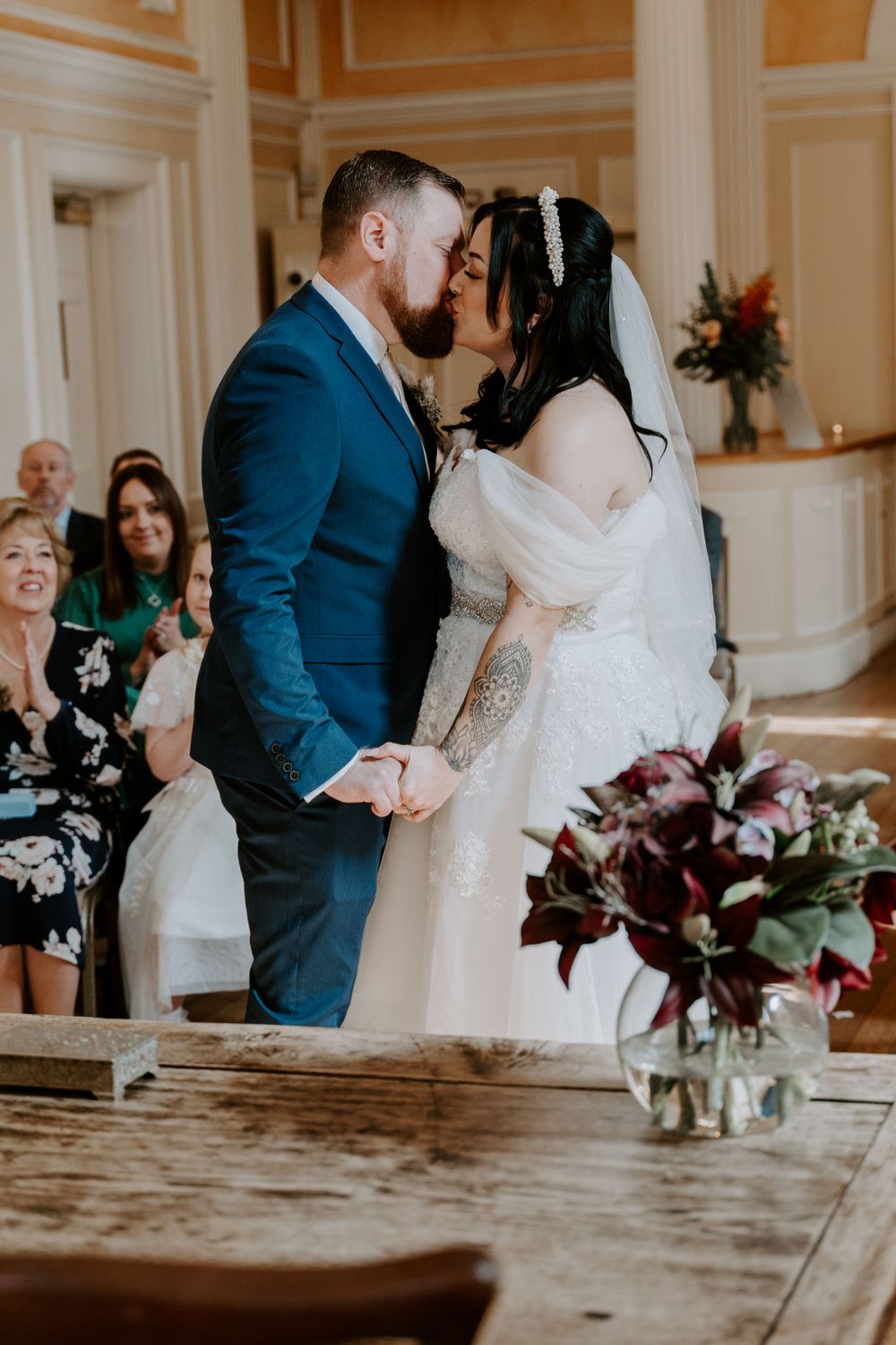 bride and grooms first kiss as a married couple.