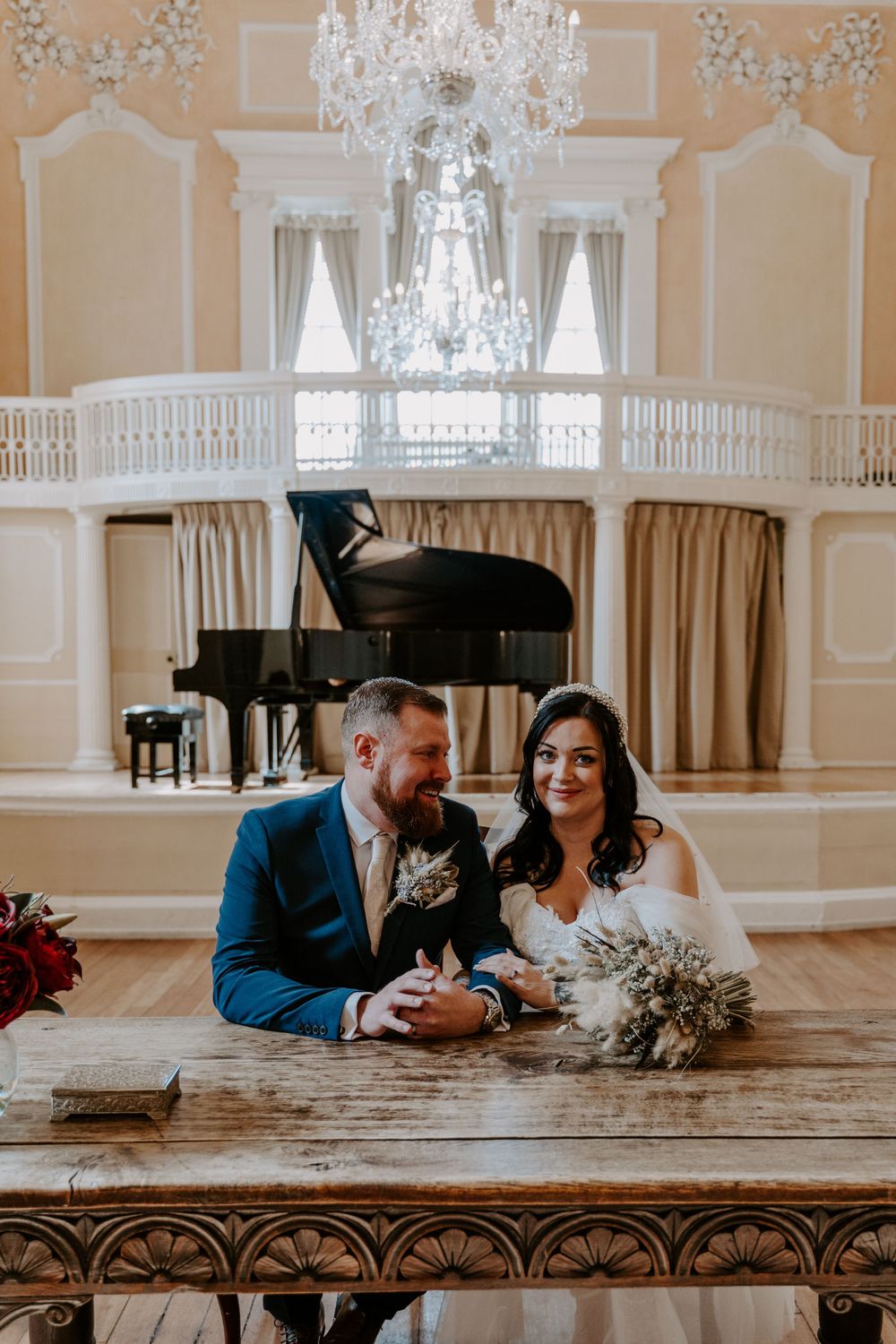 bride and groom signing the register.