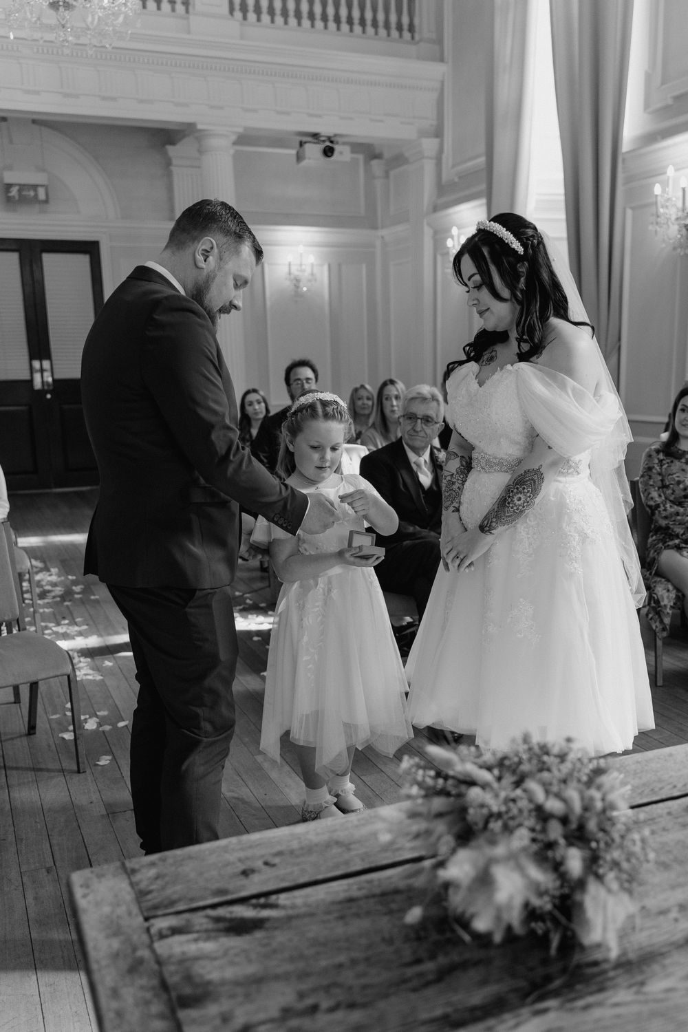 the flower girl bringing the rings up to her parents during their vows.