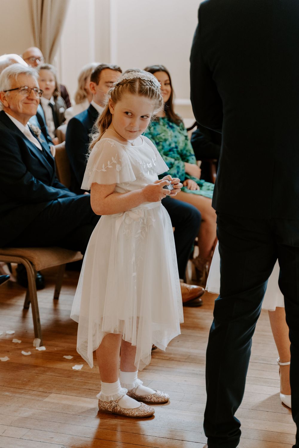 the flower girl bringing the rings up to her parents during their vows.