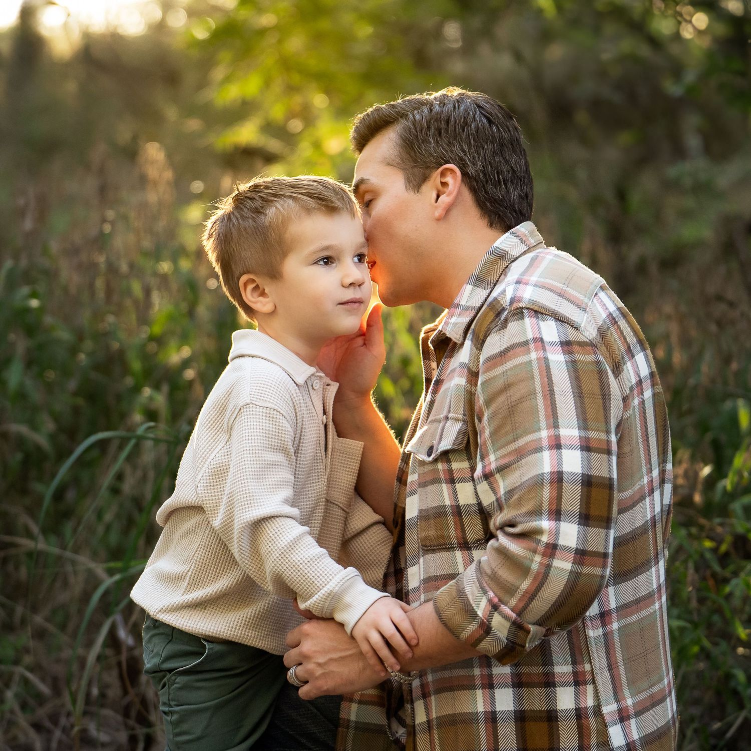 Cibolo Creek Nature Center father whispering to son in field