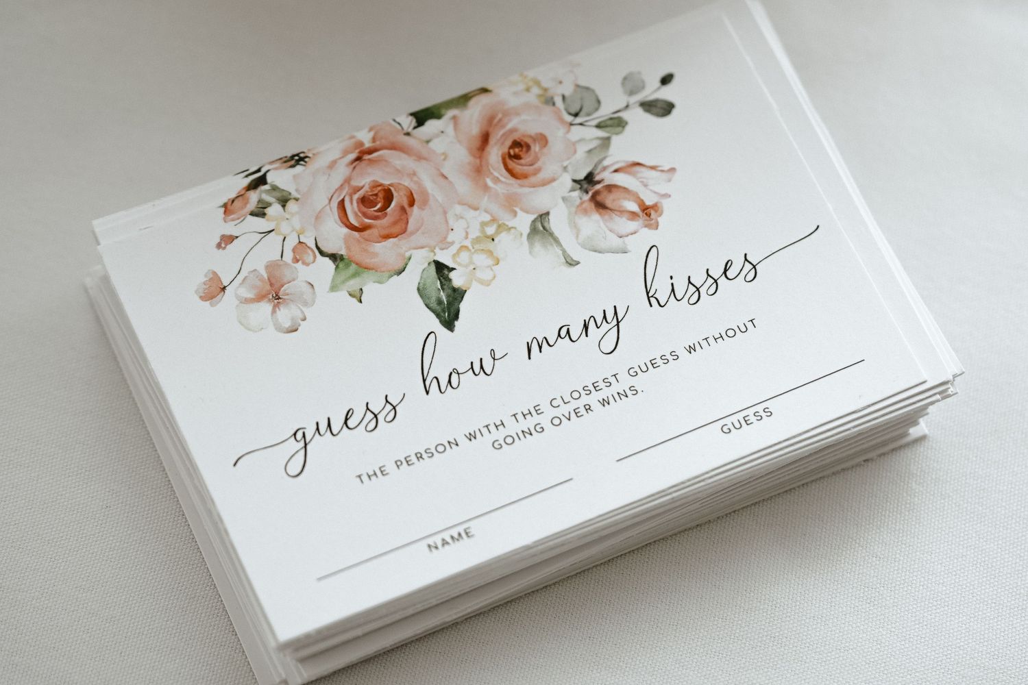 Elegant floral wedding stationery cards on a light surface.
