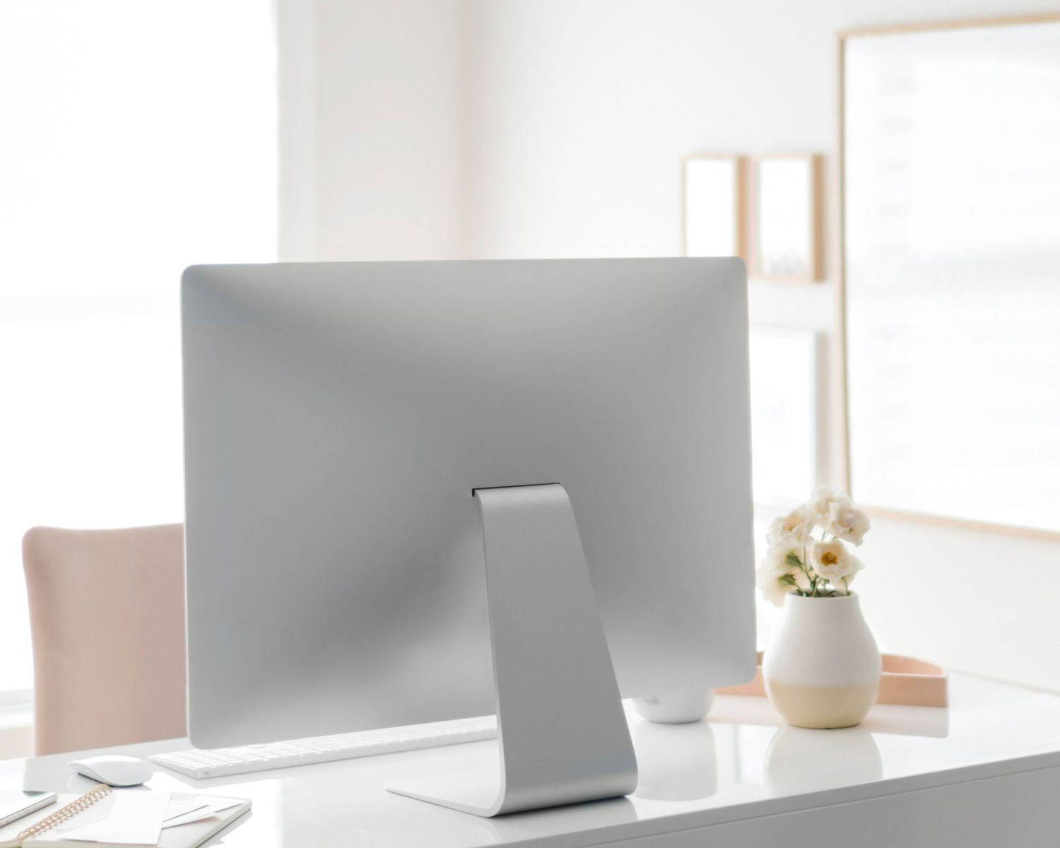 Computer on a desk with trendy aesthetic accents