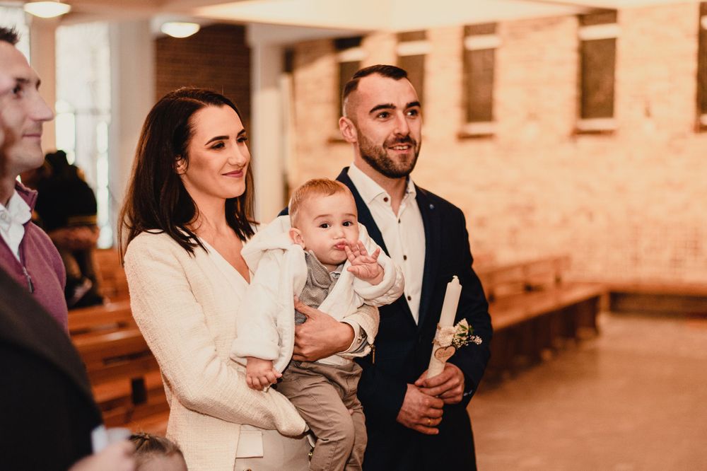 A joyous celebration in an indoor venue with warm lighting and brick walls.
