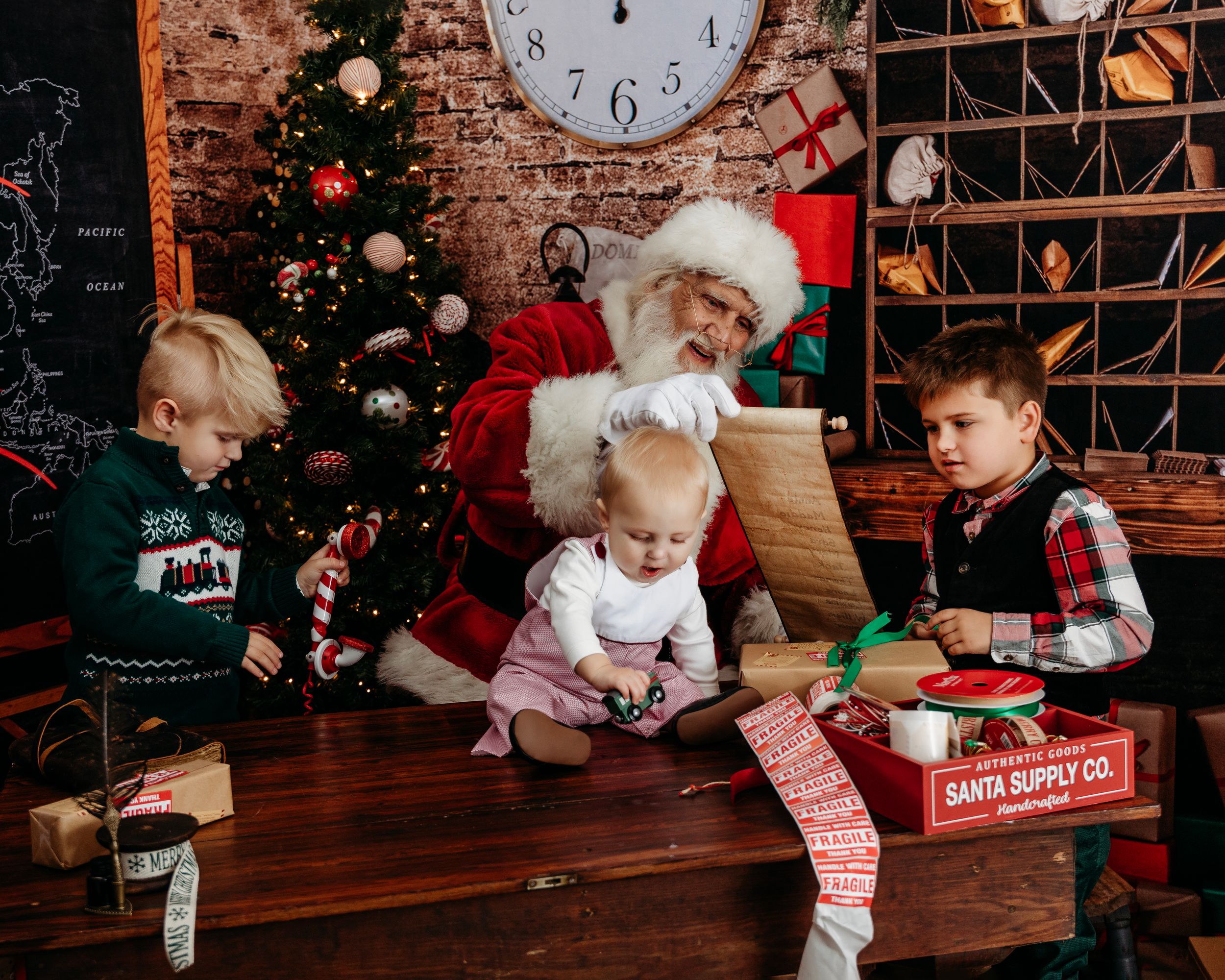 Series of Christmas photos with a rustic brick wall backdrop and holiday decorations. Santa photographer
