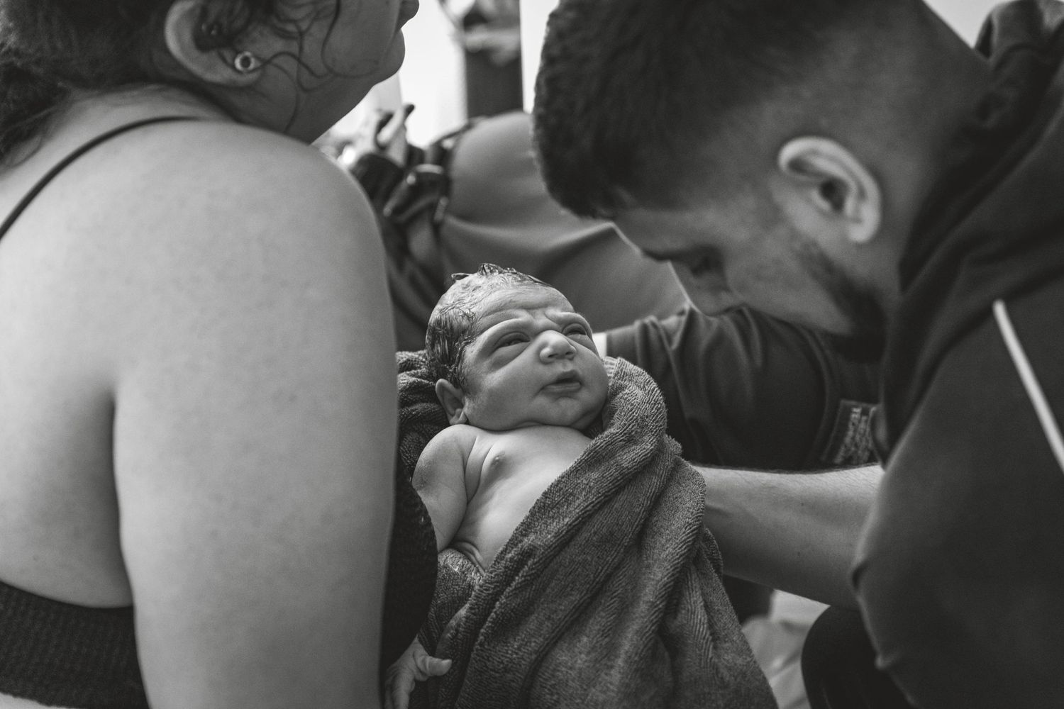 Black and white image of person during water birth experience. Photographer. Hull. East Yorkshire. Photography