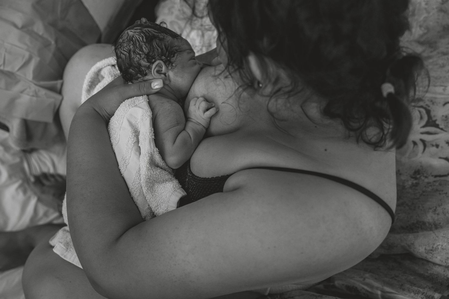 Intimate black and white photo of a tender moment with a newborn baby sleeping. Photographer. Hull. East Yorkshire. Photography