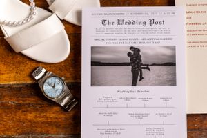 Wedding newspaper announcement with black and white photo displayed with silver watch.