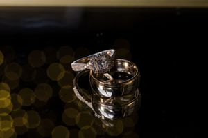 Crystal wine glass with bokeh lights in background creates an elegant party atmosphere.