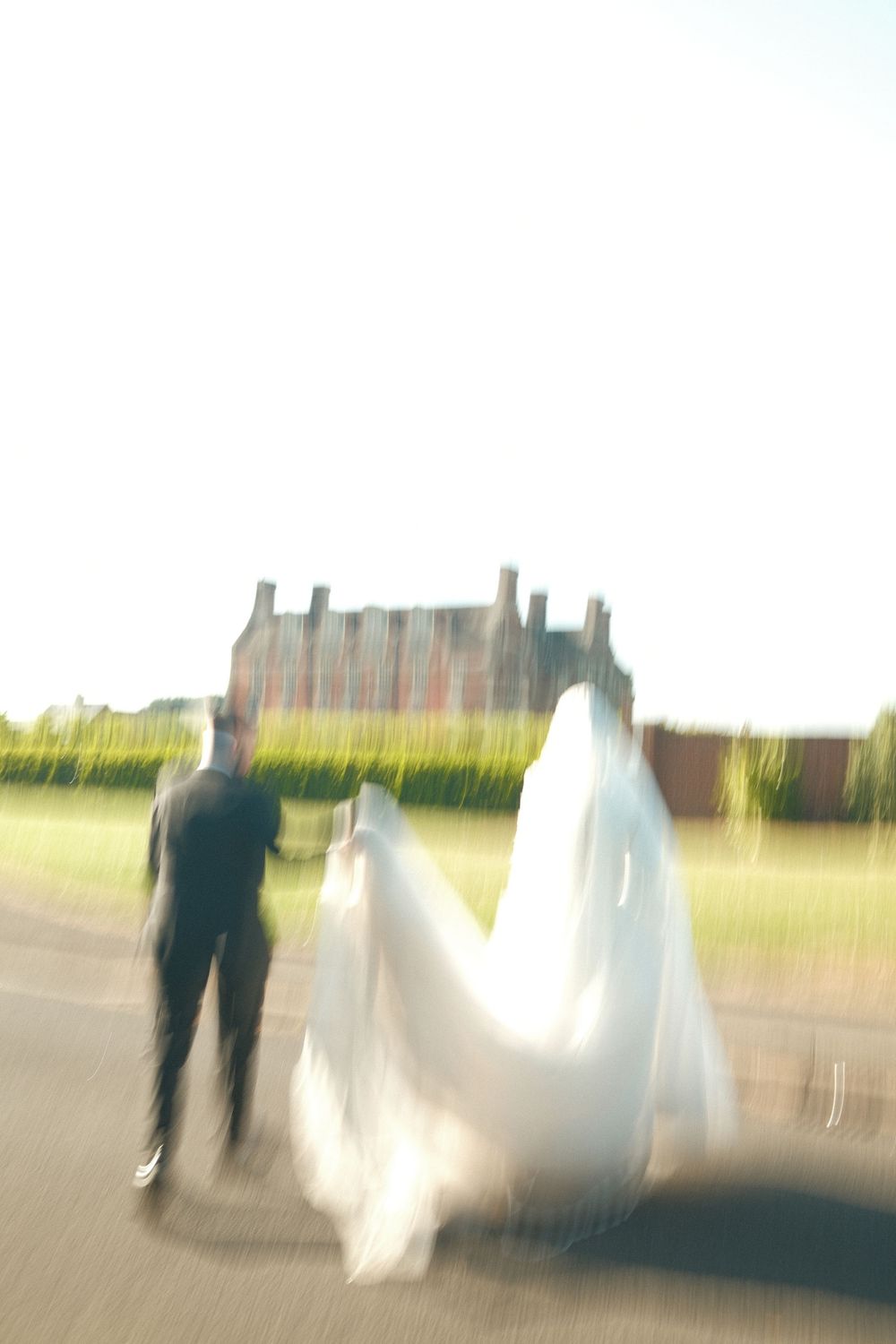 Blurred motion wedding photography shot outdoors with soft dreamy effect.
