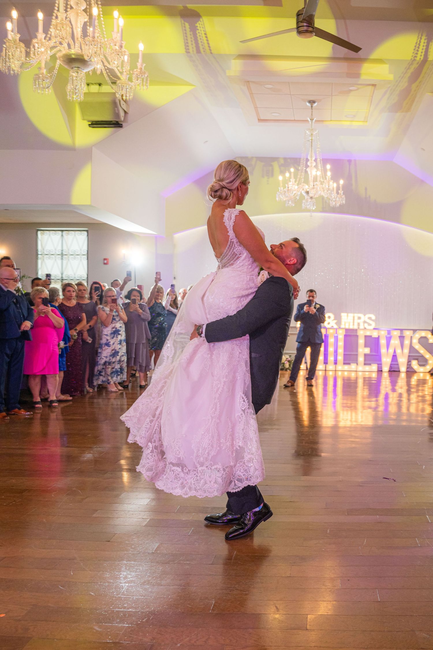 DANCING NEWLY MARRIED  COUPLE AT A WEDDING WITH FOG ON THE DANCE FLOOR.