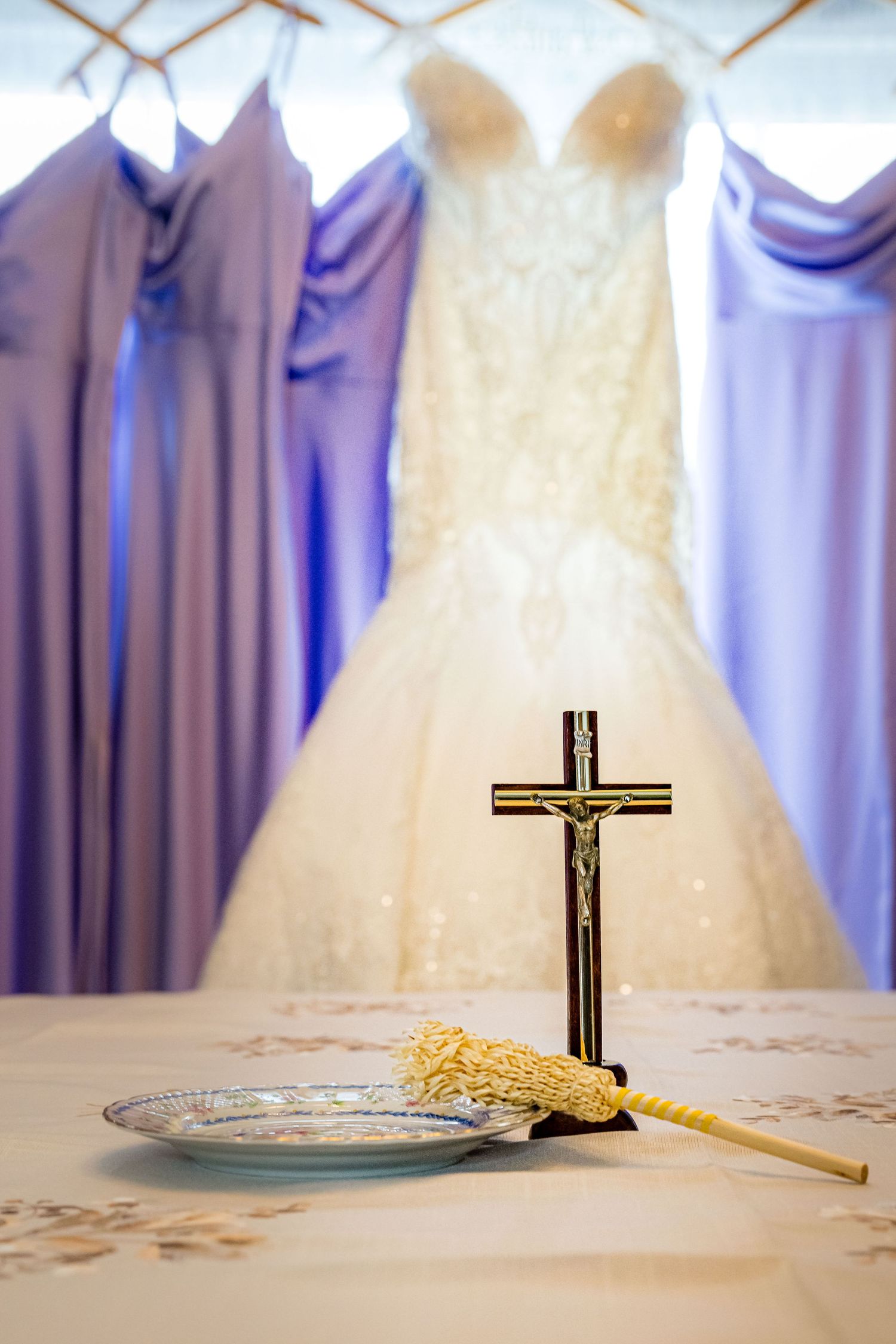 WEDDING FRESS AND BRIDE MAIDS  DRESSES  WITH A CATHOLIC CROSS IN FRONT OF IT