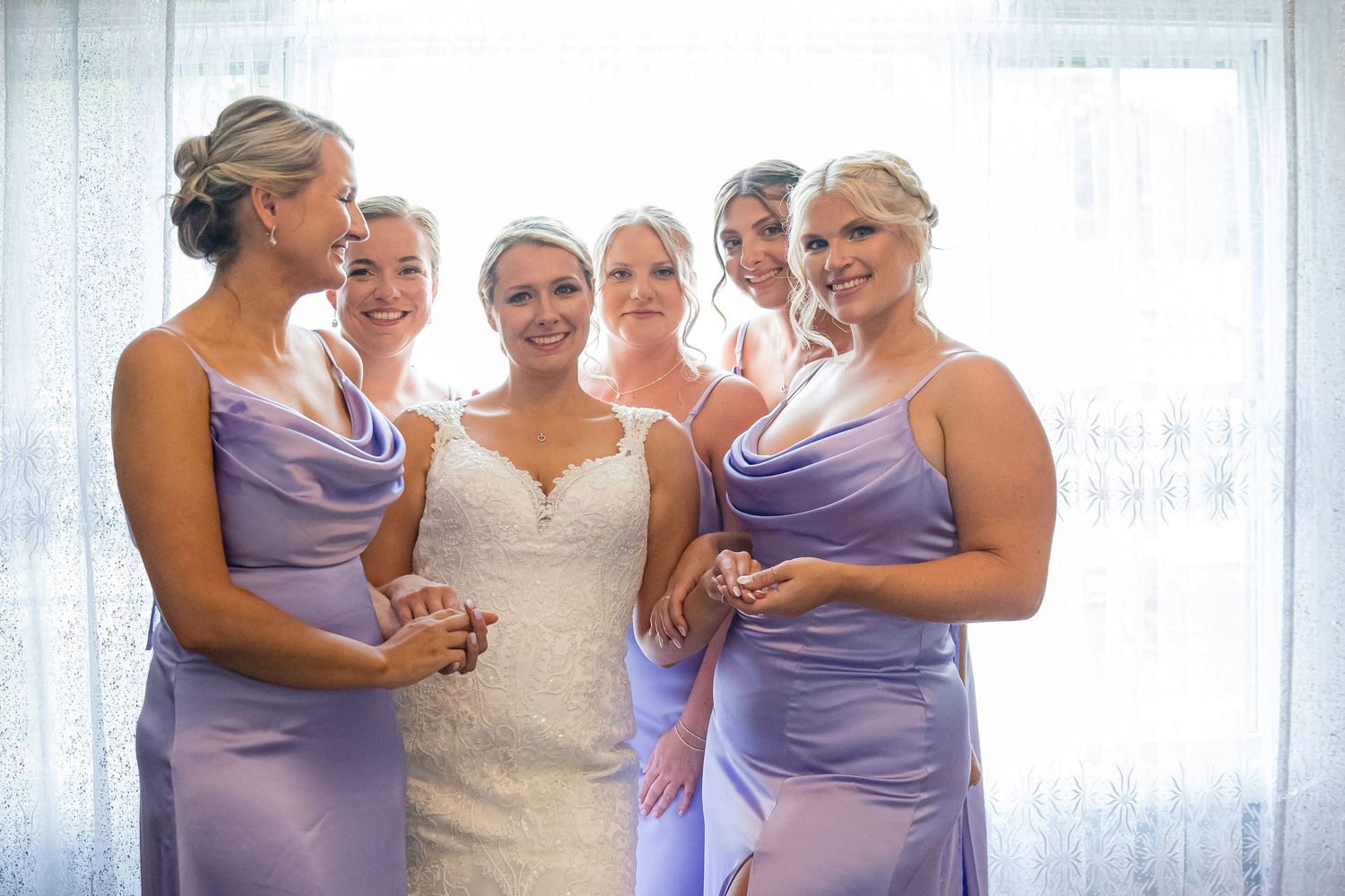 BRIDE AND HER CLOSEST FRIENDS WITH HER SISTER HAVING FUN AT GETTING READY PORTRAIT SESSION.