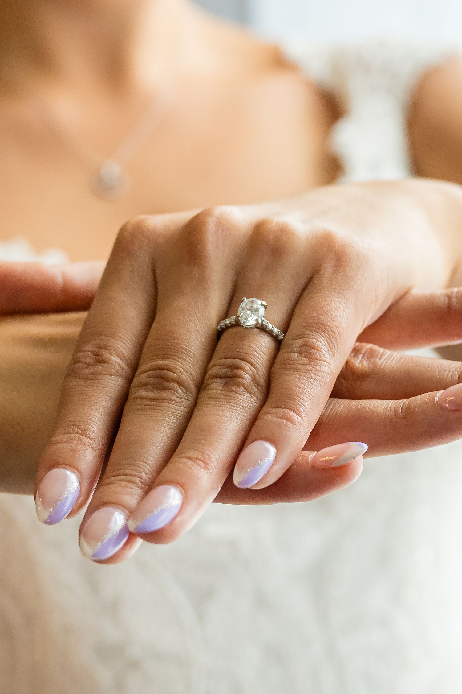 ENGAGEMENT RING ON BRIDES HAND
