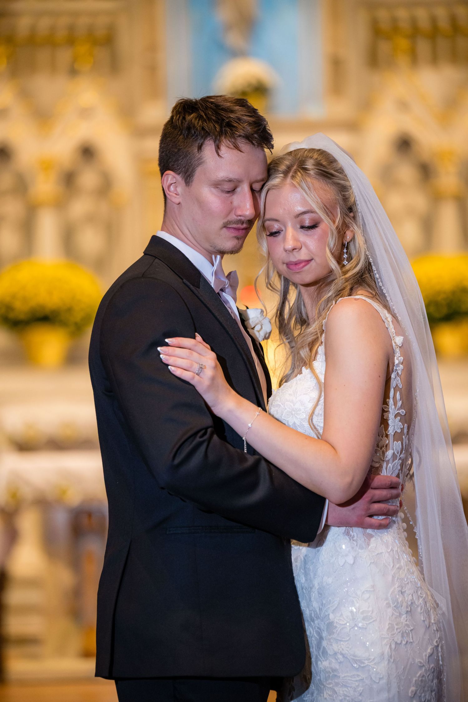 Romantic first dance sequence between newlyweds in an ornate ballroom with warm lighting.