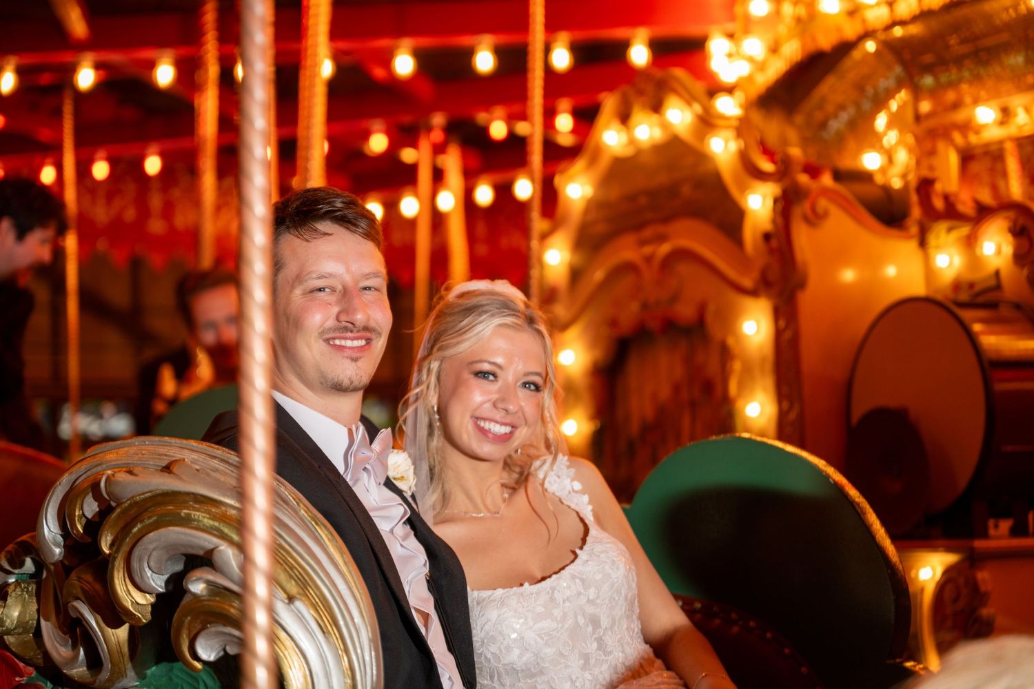 Couples dance and celebrate at an elegant wedding reception with warm glowing lights and romantic ambiance.