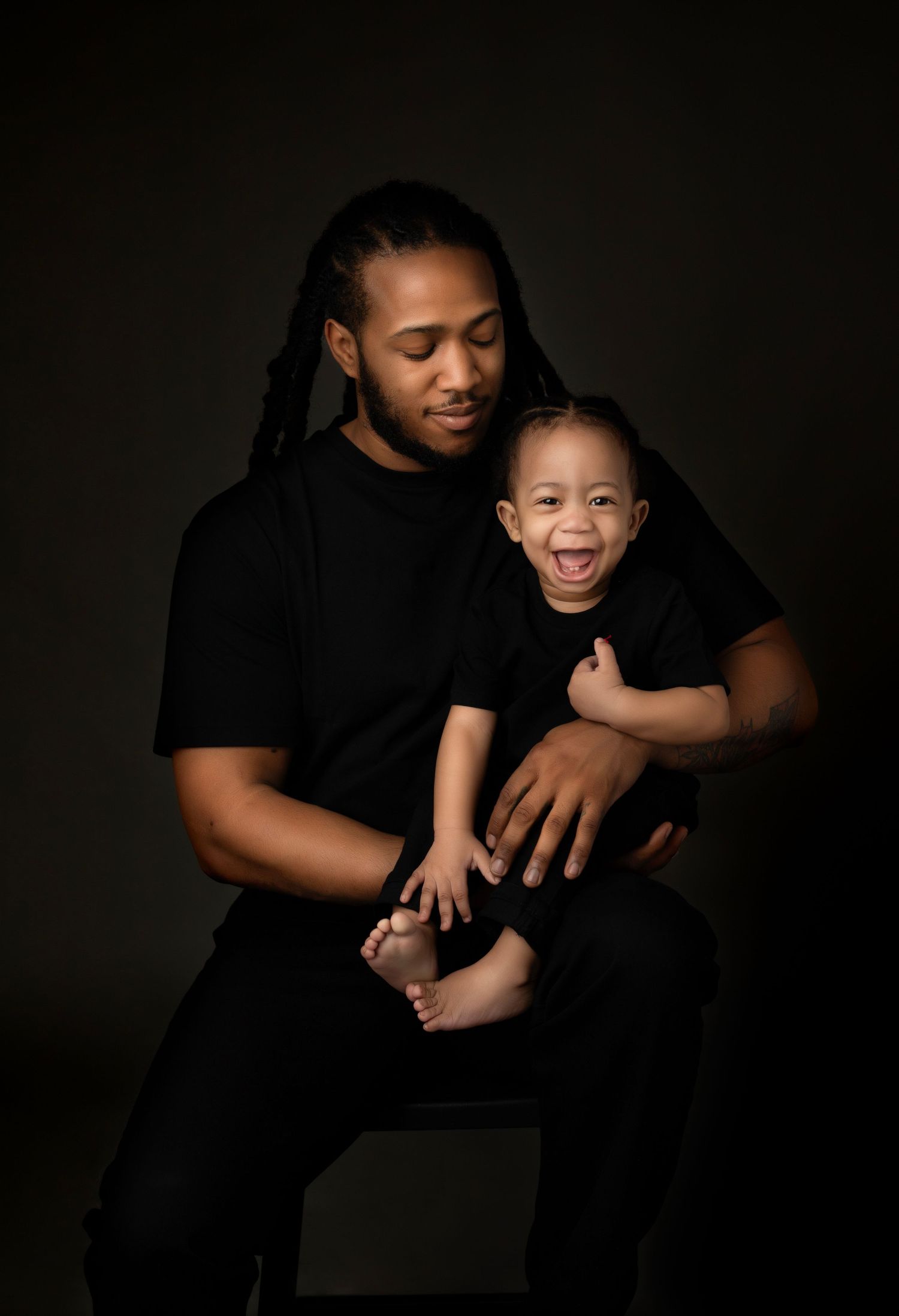 Playful parent-child studio photos in matching white shirts and jeans.