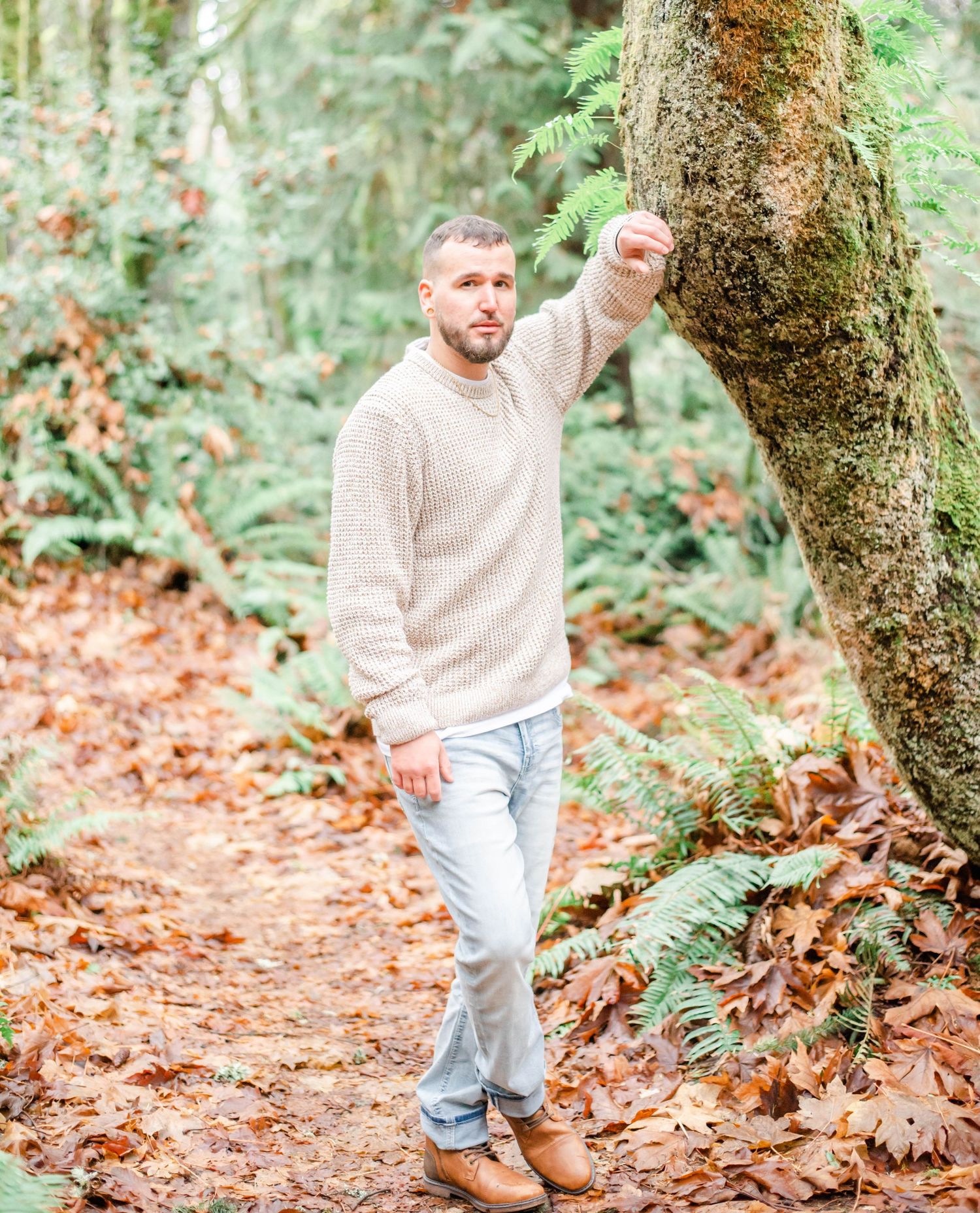 Walking on autumn forest trail surrounded by fallen leaves.
