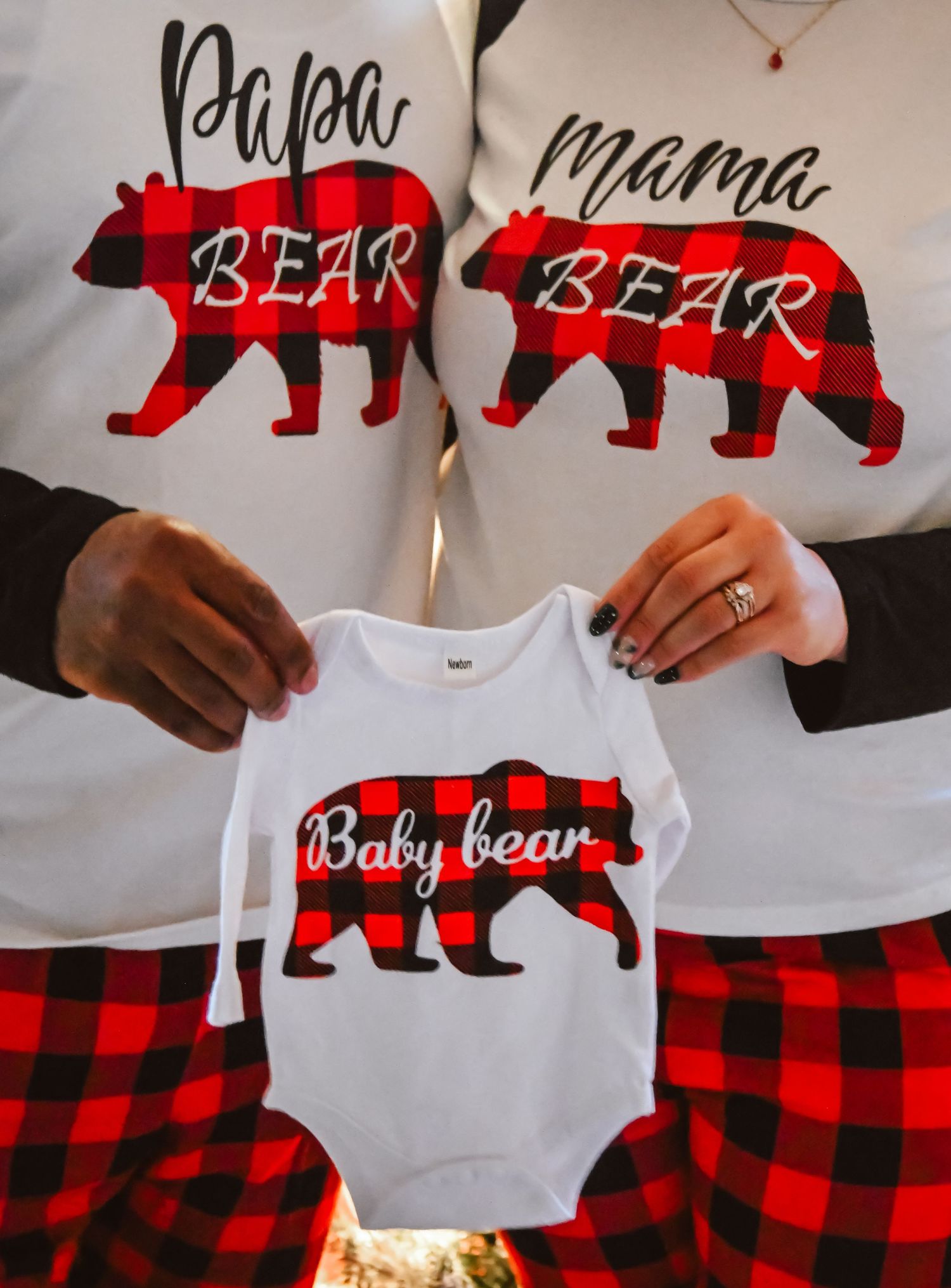 Matching family shirts featuring Papa Bear, Mama Bear, and Baby Bear in buffalo plaid design.