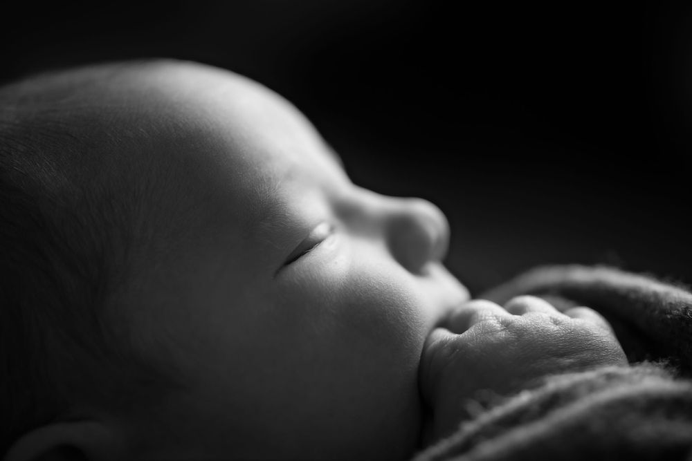 A series of black and white newborn baby. Macro details
