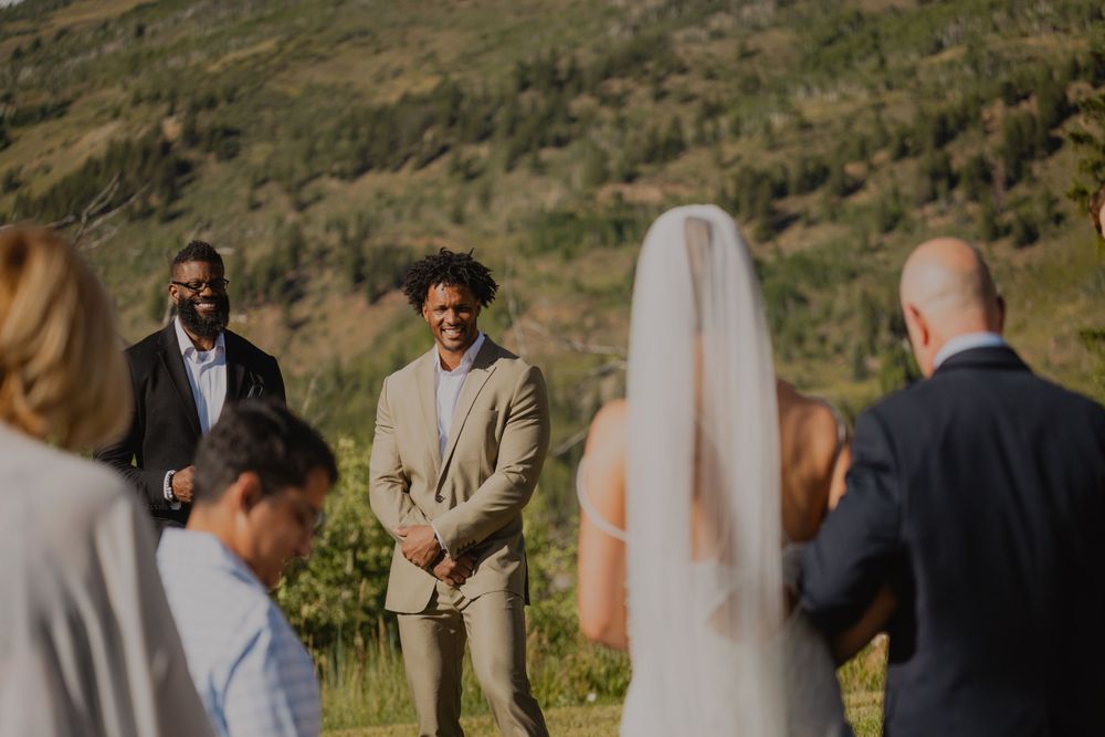 Groom's emotional reaction as bride walks down the aisle at Apache Ranch in Silverthorne
